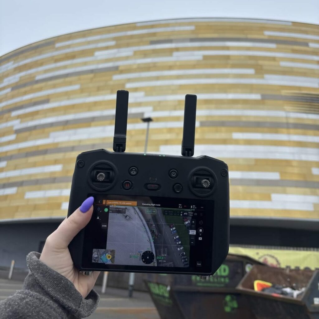 drone controller in front of the velodrome drone controller in front of the velodrome